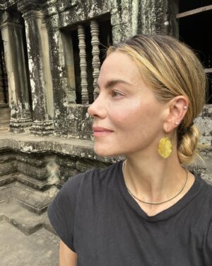 Michelle Monaghan Instagram - Lost in the magic of the ancient temples of Angkor Wat, aka “City of Temples”.✨This Eighth Wonder of the World is the largest religious monument in the world! Built 900 years ago, it holds the mythology of both Hindu and Buddhism religions. To experience its sheer beauty at sunrise was a dream come true. 💫Thank you to my incredible Cambodian tour guide “Lee” @chhvn1y_chhorn for the history lesson and for capturing our awe-inspiring day. I’ll treasure it forever. 🙏 #angkorwat #cambodia