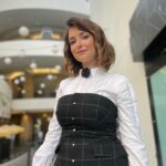 Milana Vayntrub Instagram - My favorite pastime is watching Marina talk. Particularly fun when it’s about our film “Pickled Herring”. Top & corset by @honaydaofficial Flower clip by @maguireshoes Ring & earrings by @sterlingforever Shoes by @ysl Styling by @fashiontulle