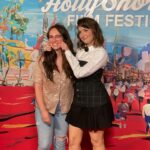 Milana Vayntrub Instagram - My favorite pastime is watching Marina talk. Particularly fun when it’s about our film “Pickled Herring”. Top & corset by @honaydaofficial Flower clip by @maguireshoes Ring & earrings by @sterlingforever Shoes by @ysl Styling by @fashiontulle