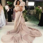 Mindy Kaling Instagram – The name of my gown was “The Melting Flower of Time”. I was so honored to wear the genius @gauravguptaofficial to the Met Gala this year. The cape was inspired by a blooming flower, and his signature sculptural techniques evoked the passage of time. Thank you Gaurav, @voguemagazine and the team of artists who designed my look! 🤍🤍🤍 
📸: @gettyentertainment