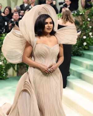 Mindy Kaling Instagram - The name of my gown was “The Melting Flower of Time”. I was so honored to wear the genius @gauravguptaofficial to the Met Gala this year. The cape was inspired by a blooming flower, and his signature sculptural techniques evoked the passage of time. Thank you Gaurav, @voguemagazine and the team of artists who designed my look! 🤍🤍🤍 
📸: @gettyentertainment