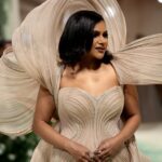 Mindy Kaling Instagram – The name of my gown was “The Melting Flower of Time”. I was so honored to wear the genius @gauravguptaofficial to the Met Gala this year. The cape was inspired by a blooming flower, and his signature sculptural techniques evoked the passage of time. Thank you Gaurav, @voguemagazine and the team of artists who designed my look! 🤍🤍🤍 
📸: @gettyentertainment