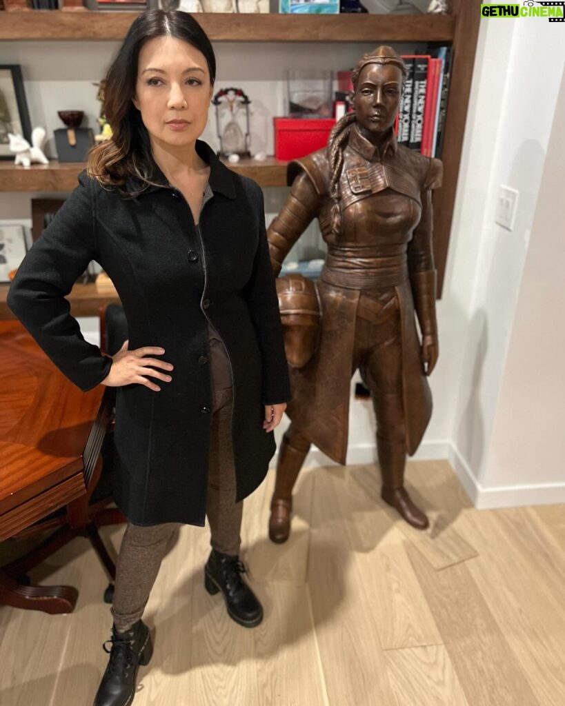 Ming-Na Wen Instagram - Like my twin?😂😂 Okay. Why do I have a LIFE-SIZE bronze statue of me as Fennec Shand? Well, my amazing husband started the process last April of having one made to celebrate my birthday. It was carved from clay from just a photo as reference. The artistry and accuracy is remarkable. Several revisions took place. (Thank you, @mitchelwuphotography & @jenchiwu for your input.🥰) This was all done in secrecy. Unfortunately, it didn't arrive in time for my birthday last November. It just arrived last week. When we had a couples night with some of our dearest friends we've known for over 20 years, Eric unveiled it. What a tremendous surprise! We were all in awe! He knows how much #starwars means to me; how being Fennec has been a childhood's dream come true for me. So he wanted to celebrate my birthday with something unique and BIG! He succeeded!! At first, I was utterly astounded and amused. I also thought he was crazy! Where the hell were we going to put it? She couldn't be outside scaring people! Once we moved her inside, she actually fits great in our media room. She's home! I love bronzed Fennec more and more, just like my love for this marvelous man. She's a daily reminder of how lucky I am to have such a thoughtful and loving husband. He's the best! Thank you, babe! I love you, always. ❤️🥰 #thisistheway #fennecshand #themandalorian #thebookofbobafett #starwars