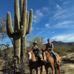 Miranda Lambert Instagram - Country and Western! 🐴🧡🌵🏜️☀️ Went back out west to AZ to visit @kenda_lenseigne again and to learn from the master. This time I brought @brendanjmcloughlin along for the ride. Literally. He doesn’t ride but figured it all out pretty quick. Kenda, you made a cowboy out of our NYC boy. 😂🤠🐴. We celebrated 5 years married on horse back this year. Love ya babe. ❤️ couples who cowboy together …. 1. Me and my gal pal / the boss @kenda_lenseigne (missing you @samanthacrook1 ) 2. Brendan and Justin, me and Cool and some new friends on a looong loooong trail ride to @haroldscorral thanks to @therealrussoresidential 😂 3. Cool and I getting to know eachother and me trying to hit my dang targets. 4.Brendan and Savvy haulin ass on his first run ever! Slow down! 😂 (@samanthacrook1 OMG )😂😂 5. Learnin to sort cows. 6. Cool and me 🧡🐴 love at first ride. 7.❤️ 💍5 years 8. The Boss on Charles. 🤠😲🤯 Cave Creek, Arizona