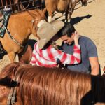 Miranda Lambert Instagram - Country and Western! 🐴🧡🌵🏜️☀️ Went back out west to AZ to visit @kenda_lenseigne again and to learn from the master. This time I brought @brendanjmcloughlin along for the ride. Literally. He doesn’t ride but figured it all out pretty quick. Kenda, you made a cowboy out of our NYC boy. 😂🤠🐴. We celebrated 5 years married on horse back this year. Love ya babe. ❤️ couples who cowboy together …. 1. Me and my gal pal / the boss @kenda_lenseigne (missing you @samanthacrook1 ) 2. Brendan and Justin, me and Cool and some new friends on a looong loooong trail ride to @haroldscorral thanks to @therealrussoresidential 😂 3. Cool and I getting to know eachother and me trying to hit my dang targets. 4.Brendan and Savvy haulin ass on his first run ever! Slow down! 😂 (@samanthacrook1 OMG )😂😂 5. Learnin to sort cows. 6. Cool and me 🧡🐴 love at first ride. 7.❤️ 💍5 years 8. The Boss on Charles. 🤠😲🤯 Cave Creek, Arizona