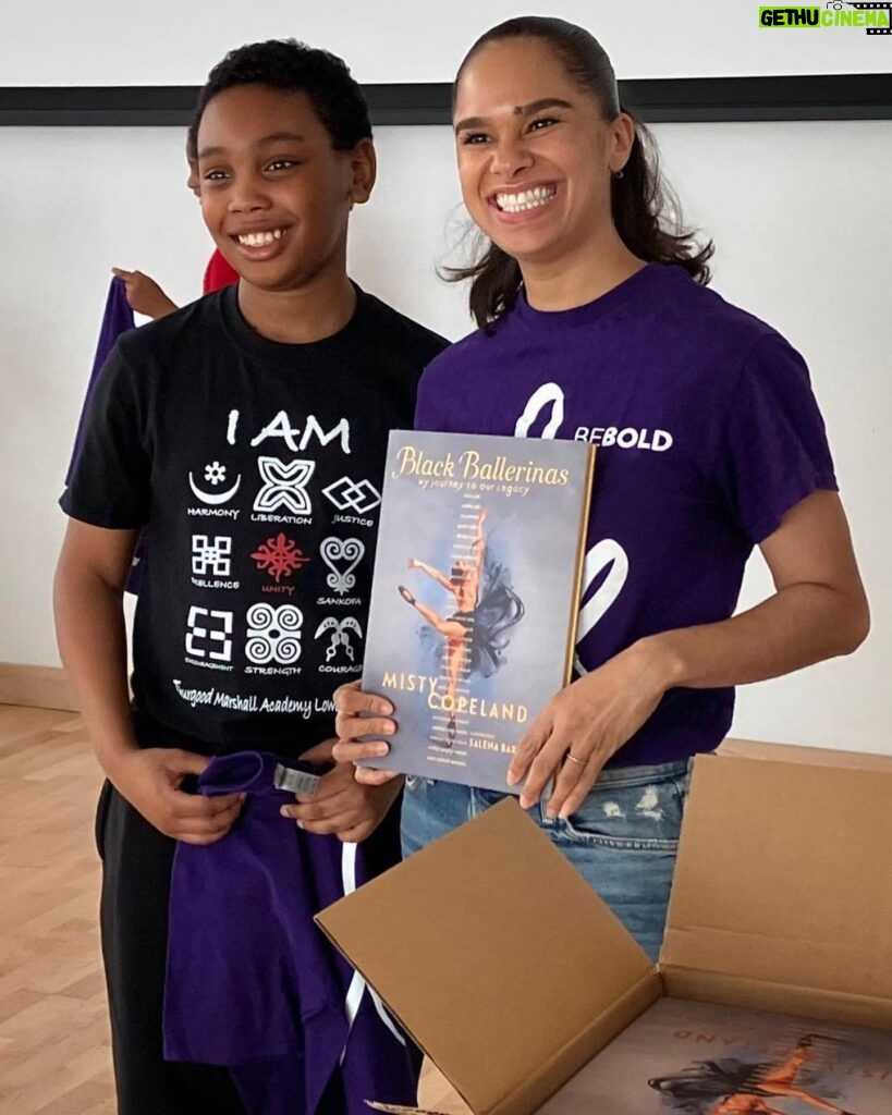 Misty Copeland Instagram - #Repost @mistycopelandfdn ・・・ Misty Copeland surprises BE BOLD students and their families on the first day of class at the new Pinkerton Clubhouse in North Central Harlem (@MadisonBGClub). Misty distributes BE BOLD t-shirts and signs copies of her book “Black Ballerinas” while posing for pictures with students. The state-of-the-art Boys and Girls’ Club offers a rooftop soccer field, a music recording studio, a full-sized basketball court and, now, BE BOLD ballet classes! @mistyonpointe #ProudToBeBold #EquityInDance #BalletForAll #ThisIsWhatBalletLooksLike