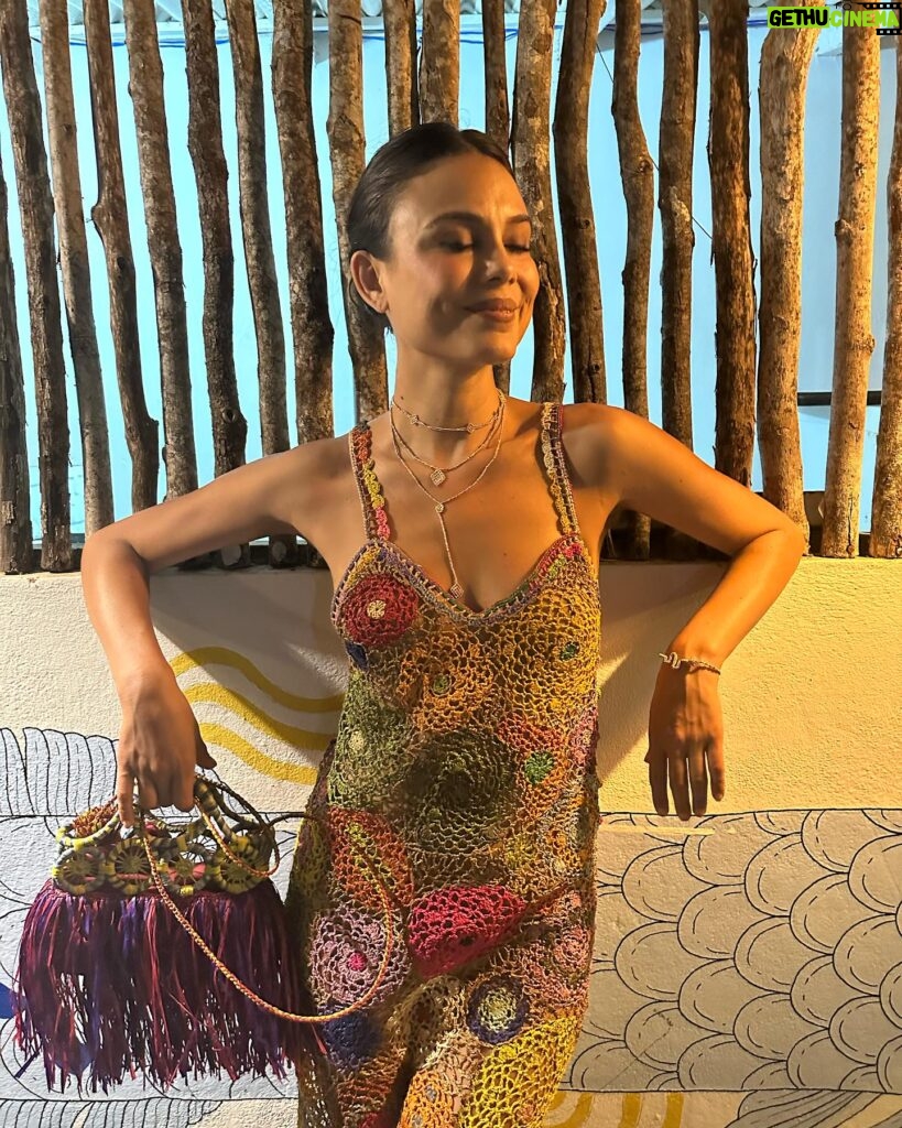 Nathalie Kelley Instagram - Could fashion come to the rescue of communities, ecosystems and ancestral knowledge… in the near future? That was the theme of @mrspress new book Wear Next that I was most excited to explore. Vogue’s first sustainability editor and host of one of my favorite podcasts Wardrobe Crisis, Clare’s book looks at the fashion innovators looking to “craft new satirical identities that don’t wreck the planet.” When it comes to innovation I like to look towards traditional communities and the ways in which their raw materials and fibers regenerate rather than pollute their landscapes. From the alpaca farmers and weavers in the Sacred Valley that create @moonrising.co’s beautiful ponchos, to the way @madeforawoman uses raffia palm from biodiverse forest systems in Madagascar to create beautiful and biodegradable clothes, bags and shoes. I am inspired by designers like @zazi.vintage who centre the makers of the clothes and much as those who model them. This is just a sliver of the future that @mrspress lays out for us in her fabulous new book. I highly recommend it - that’s why I offered my quote for the cover! I’m dreaming of the day we can be clothed in seeds rather than SKIMS (speaking of which - my top in the first photo is made entirely from Acai seeds and the Tucum fiber by artisans in the Amazon. It is sold by the lovely @yanciamazonia ) Who is with me? Seeds not Skims? Materials that come from standing forests not from dead trees! Clothes connected to ancestral ways of farming and stewarding the land! Fashion could return to its roots and be a source of inspiration for true beauty and justice… can we collectively dream and weave this future into being?