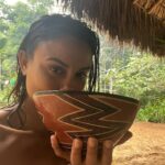 Nathalie Kelley Instagram - When I first came across @ninagualinga and her incredible work a few years ago, the idea of visiting her in her village of Sarayaku was a distant dream. That dream was recently made a reality when I was invited to celebrate @ninagualinga’s 30th bday surrounded by her friends, family and ayllu (community). What a privilege for @andresalonso7 and I to wake up and drink Guayusa with her mama, and listen as she interpreted our dreams and shared her wisdom. What bliss to swim in these crystalline waters and appreciate the beauty of a primary rainforest, lovingly managed by the Kichwa community. I know our respective Quechua and Kichwa ancestors were and still are connected by language and culture and by a shared reverence for Pachamama… thank you @ninagualinga @helenagualinga @inayusiren for welcoming me to Sarayaku, the first of many trips I hope to make you this magical part of the Amazon. 🔹And thank you @andresalonso7 for saying yes to this trip of a lifetime. The image of you drinking chicha will be forever embedded in my memory 😂.