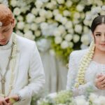 Nessie Judge Instagram - Akad Ceremony of Nessie & Andryan. - Photo & Video — @byputrida Exclusive Media Partner — @thebridestory Wedding Planner — @pure.organizer MUA @vinnagracia @vgmakeupstudio Bride’s Attire — @wirantikurniabride Groom’s Attire — @beskapan Shoes — @jimmychoo Ring — @tiffanyandco Decoration — @tuesdayproject Live cam — @viding.co Invitation — @invitto.printery Venue — @alilascbd