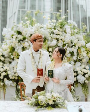 Nessie Judge Instagram - Akad Ceremony of Nessie & Andryan. 
-
Photo & Video — @byputrida 
Exclusive Media Partner — @thebridestory 
Wedding Planner — @pure.organizer
MUA @vinnagracia @vgmakeupstudio
Bride’s Attire — @wirantikurniabride
Groom’s Attire — @beskapan
Shoes — @jimmychoo 
Ring — @tiffanyandco 
Decoration — @tuesdayproject
Live cam — @viding.co 
Invitation — @invitto.printery 
Venue — @alilascbd