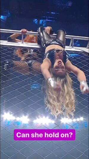 Patricia Stratigeas Instagram - @trishstratuscom is DANGLING from the top of the Steel Cage! 🫢 #WWEPayback
