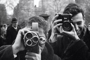 Paul McCartney Instagram - Looking at these photos now, decades after they were taken, I find there’s a sort of innocence about them. Everything was new to us at this point. But I like to think I wouldn’t take them any differently today - Paul

📷 Self-portrait. London, 1963 
📷 Photographers in Central Park. New York, 1964

More photographs have been released ahead of the new @nationalportraitgallery exhibition Paul McCartney Photographs 1963-64: #EyesOfTheStorm 

28 June - 1 October 2023. Book via @nationalportraitgallery 

Pre-order the book '1964: #EyesOfTheStorm' via the link in bio