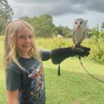 Pink Instagram - Its an absolute JOY to travel with my kids and be able to show them different lands and customs and culture and peoples and animals. Today was our second time visiting @lonepinekoala and it was amazing to understand and learn so much about koalas, Roos, dingos and raptors. For instance- barn owls fly silently and falcons are the fastest animal on Earth. Clocking in at 241 mph in flight. That’s fast. Also, barn owls enjoy being sung to, while kangaroos really just prefer grass and quiet time. And these tiny, brown, round balls in the field aren’t chocolate like @hartluck said they were.