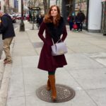 Rebecca Mader Instagram - Feeling fabulous on The Magnificent Mile in Chicago! What an amazing City! Trench: @coltondane Dress: @ronnykobo Boots: @sam_edelman Bag: @zacposen Stylist: @gabriellangenbrunner