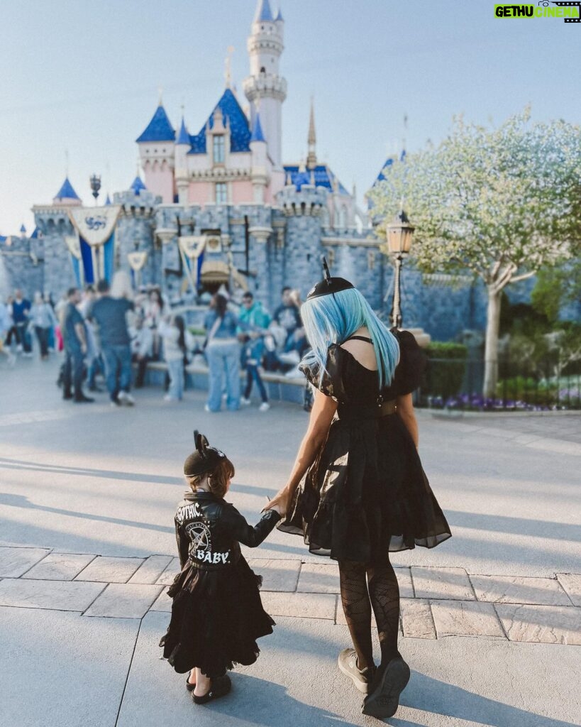 Rebecca Victoria Hardy Instagram - Dark paradise 🖤🦇🕸️ Ears: @batsday Jacket: @blackcraftcult #disneyland #gothicbaby #batsday #alt #goth #mommyandme