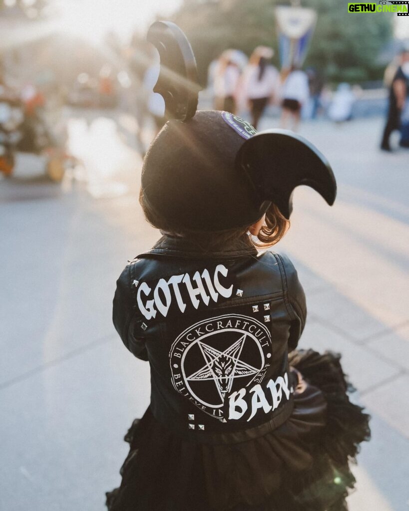 Rebecca Victoria Hardy Instagram - Dark paradise 🖤🦇🕸️ Ears: @batsday Jacket: @blackcraftcult #disneyland #gothicbaby #batsday #alt #goth #mommyandme