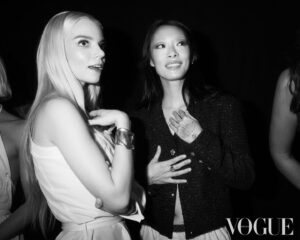 Rina Sawayama Instagram - @britishvogue ❤️ photographed by @NedRogers and styled by @Edward_Enninful, my glam @frankieboyd @evaniefrausto, wearing @chanelofficial [Image Description: Slide one, a black and white image shows, from left to right, Gemma Chan, a woman of Chinese heritage, Simone Ashley, a woman of Indian Tamil heritage, Rina Sawayama, a woman of Japanese heritage, Anya Taylor-Joy, a white woman, Maya Jama, a Black woman, Paloma Elsesser, a Black woman, and Jameela Jamil, a woman of Indian and Pakistani heritage. Simone, Anya and Paloma are sitting on stools, and the other women are standing. All seven are looking at one another and laughing.