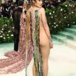 Rita Ora Instagram - My 10th MET! Thank you @voguemagazine. This years theme: Sleeping Beauties: Reawakening Fashion. This dress encapsulates in the most delicate and powerful manner a real tapestry of human crafts spanning a period of two millennia from Egypt to Rome. ⌛️⏳💫❤️ It is composed of one of a kind antique glass beads from all over the world, highlighting one of humankind’s most ancient crafted objects and paired together with antique handmade glass beads from Murano ranging between the 40’s all through to the 70’s. It has been constructed as if all the vertical beads have been weaved together to make an intricate pattern play between colour and texture. The verticality of the dress elongates the silhouette, and the slight tension around the waist exhale the curves of the body further. It is all hanging from a beautiful handmade metal structure that adorns the neckline almost as a jewel and defines it in a very graphic way. Thank you dream team 💫🥹⏳ @Marni @asliceofbambi Jewellery: @buccellatimilan Makeup: @makeupbyrhc @charlottetilbury @charlottetilburyskincare Hair: @brentlawler and @typebea Styling: @pippa.atkinson Photographer: @ppress_photography Videographer: @melissespinosa @metcostumeinstitute @voguemagazine @gettyentertainment
