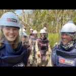 Rosamund Pike Instagram – In Battambang Province Cambodia, once again seeing with my own eyes the tireless efforts of teams of female deminers, working in swelteringly hot conditions protected by heavy, constrictive PPE, on uneven terrain. The undergrowth they have to clear to find the mines, remnants of wars over 30 years past, is dense, tangled and resistant. Many families live face to face with land still heavily contaminated with unexploded ordnance. The efforts of MAG are sensitive, expert, dedicated and inspiring. #proudambassador #landmines #cambodia