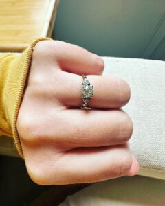 Sara Bareilles Instagram - We have been engaged for a year and this is the ring we chose- we picked it up yesterday. We bought the gold leaf at an arts fair in Mexico City last December because looking for a ring started to feel like it was distorting and eclipsing the beauty of choosing each other. Joe found this ring at an antique store upstate. I was buying tiny lamp shades. (So cute!) It didn’t fit my finger so I was scared to take the leap. I had been thinking I should go get something custom or really hunt for the “right ring” so I balked at it. We drove back to our house without it and talked about the concept of the ring. That it is something he wants to give me, not just get for me. That the leap of faith of not quite knowing if it was “the one” is just that. A leap of faith. And isn’t that life? I look at this ring and think of his big blue eyes and how sometimes they are pleading with me to let go and grow into something new with him. So I did. And we got it the next day and got it sized and now I just love that I see him when I look at it- I like looking at you @joetipps. Exceptional “hand holding things” pictures were taken by me. Please credit me I’m a very important photographer.