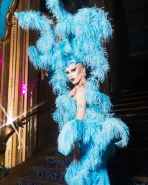 Sasha Velour Instagram - Merci Paris 🦋💎🌹

An extravagant moment in life— wearing a custom @serand_create dress and headpiece for my sold-out show at the @foliesbergere_officiel, channelling the original showgirls of Paris with an extra camp twist…all while traipsing about the haunted theatre with photographer @mettieostrowski to get these incredible photos! I might have cried a little. 

Plus I loved sharing the stage with the queen of FRANCE @thenickydoll! All around a dream come true. Merci bien!