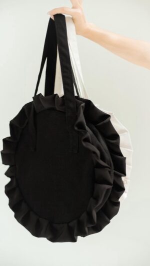 Shaina Magdayao Instagram - Let’s circle back to this modern ruffled bag. 🖤

FRILL CHIFFON
Round bag with ruffles
Colors: White, Black (featured), Army Green, Denim
Sizes: Small, Large

BAGS. CLOTHING. JEWELRY. SHOES. HOME
#supportlocal 🤎

Shop responsibly for everyday canvas bags.
DM to pre order: @organizedchicas
Add to cart on Shopee: The Organized Chicas PH
Browse our online catalogue, link in bio: https://linktr.ee/theorganizedchicas

#theorganizedchicas #theorganizedchicaslifestyle #ecoconscious #ecofriendly #locallymadeph
#supportlocalph #sustainbleph #bags #bagsph #canvasbag #totebag #circlebag #roundbag
#ruffledbag