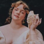 Shannon Purser Instagram - 🌷✨Backwoods Venus✨🌷 when I first saw these photos after our shoot in the summer, I didn’t know how to feel. they were beautiful. everything Valheria does is beautiful. she’s a true visionary and I consider myself so lucky every time we get to shoot together. the whole team behind these pictures is amazing and even though it was a humid, sweaty shoot in a creek that probably had snakes, it was a great day. so what was the hesitation? I felt exposed. I felt overwhelmingly aware of my body and how short it falls of the beauty standards our society has indoctrinated us with. indoctrinated me with. ever since I was maybe 10, I’d internalized the idea that fat is one of the worst things you can be. I learned that if you are fat, your options are to punish your psyche and your body until you are not or try to compensate however you can. I got good at makeup. I am strategic about how much skin I show and where. I cast myself as the “mom friend” even when it felt wrong because, in my mind, being desirable wasn’t really an option. I’ve realized over the years that I’m not just strategic about revealing my body. I’m strategic about revealing my soul- who gets to know me and how well. sometimes that’s wisdom. other times, it’s just a debilitating fear of vulnerability-a reflexive shrinking away from a potential hurt. what I do know is that the hiding hurts more than the exposure. dreading the moments someone wants to see me in my entirety, body and soul, hurts. so, here I am, exposing myself. I am not confident. I am just refusing to let my fear keep me from living. I am just me. photos: the legend herself, @valheria123 (she also did my nails bc what can’t she do?) makeup: @chandlerwest custom clothing and styling: @studio.tessafay hair styling and extensions: @_treyanthony @jessicawrighthair @your.mane.thing @melrosemcqueen assistants: the iconic @demetriusw @savanaogburn