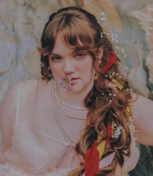 Shannon Purser Instagram - 🌷✨Backwoods Venus✨🌷

when I first saw these photos after our shoot in the summer, I didn’t know how to feel. they were beautiful. everything Valheria does is beautiful. she’s a true visionary and I consider myself so lucky every time we get to shoot together. the whole team behind these pictures is amazing and even though it was a humid, sweaty shoot in a creek that probably had snakes, it was a great day. so what was the hesitation?

I felt exposed. I felt overwhelmingly aware of my body and how short it falls of the beauty standards our society has indoctrinated us with. indoctrinated me with. ever since I was maybe 10, I’d internalized the idea that fat is one of the worst things you can be. I learned that if you are fat, your options are to punish your psyche and your body until you are not or try to compensate however you can. I got good at makeup. I am strategic about how much skin I show and where. I cast myself as the “mom friend” even when it felt wrong because, in my mind, being desirable wasn’t really an option. 

I’ve realized over the years that I’m not just strategic about revealing my body. I’m strategic about revealing my soul- who gets to know me and how well. sometimes that’s wisdom. other times, it’s just a debilitating fear of vulnerability-a reflexive shrinking away from a potential hurt. 

what I do know is that the hiding hurts more than the exposure. dreading the moments someone wants to see me in my entirety, body and soul, hurts. so, here I am, exposing myself. I am not confident. I am just refusing to let my fear keep me from living. I am just me. 

photos: the legend herself, @valheria123 (she also did my nails bc what can’t she do?)
makeup: @chandlerwest 
custom clothing and styling: @studio.tessafay 
hair styling and extensions: @_treyanthony @jessicawrighthair @your.mane.thing @melrosemcqueen 
assistants: the iconic @demetriusw @savanaogburn