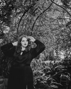 Shannon Purser Instagram - O October! Blanket me in auburn leaves and dappled sun. Speak to me in spectral winds and warm spice. Let me be not afraid of the darkness. Let me welcome the unknown to my hearth as an old friend and take its hand. Let the whispering ghosts both ancient and new come to greet me. I am a wandering spirit just like you. 🕸⚰️🖤🎃

•photos: @susieq•
•hair/makeup: @blondiewoodbeauty• 
•clothing/location: @michelinepitt @la_femme_en_noir_•