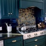 Sharna Burgess Instagram - Merry Christmas to me 🤩🤩 Kitchen rehab present from Bri. Thank you baby for knowing me so well this was THE best present ever. I am in love with this rich deep green color AND the hardware AND I even love the counter top now :) Its unreal what the right paint and little details can do. The placement of the handles is amazing too. We were about to do black because I love a black and white kitchen but it didn’t feel right in this space with the counter top and the moulding on our cupboard doors. This green feels like we’re embracing all the quirks that instead of hiding them. We’re on the search for the perfect island too. I know this is the lipstick version but wow am I obsessed. Thank you @brianaustingreen I love you so much and now I love our kitchen too! 😘♥️ #christmas #present #kitchendesign #homedecor #greenkitchen