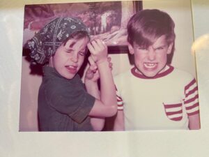 Sheri Moon Zombie Instagram - Happy Birthday @jskurkisphotos my brother and twin every year for 4 days! Here’s us as kids. I can still bend my thumb backwards. #birthdayboy #thumbtrick 🎂