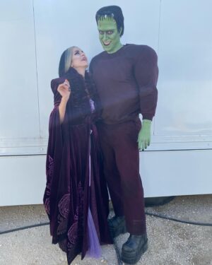 Sheri Moon Zombie Instagram - #Herman&Lily 💚❤️💚 Outside our trailers (dressing rooms) on location in #Hungary 2021 #TheMunsters #jeffdanielphillips #sherimoonzombie #robzombie