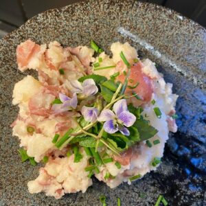 Sheri Moon Zombie Instagram - I’m learning to identify, gather and prepare wild edibles. Today I found wild violets, gathered, rinsed, sorted by leaf and stem and flower and made a warm red potato salad with a bit of veganaisse and violets. #quarantinelife #veganpotatosalad #wildviolets