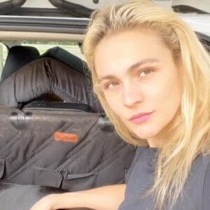 Sophie Skelton Instagram - When the rain comes in and you’ve got nowhere to go, all you need is your pup and the trunk of ya car ☔️
