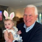 Tara Lipinski Instagram - Georgie’s first Easter and too many pics to count. Some of the ones that didn’t make stories. 🐰🥕 Our little family. 🫶 Hoping Sully thought the Easter basket was for him. Little man is so good with her, he just wants *needs* to part of everything. #easter #babysfirsteaster #babygirl #baby #6monthsold #parenting #babyanddog