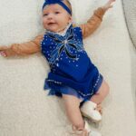 Tara Lipinski Instagram - Georgie’s 1st Halloween! ⛸️❄️ @bradgriffies made a costume that will be hard to match. Thank you!!!! Does anyone recognize it?! @toddkap commentated Gigi’s performance and I of course gave her an old school perfect 6.0 score of course! Brad - again thank you! It’s just too much. You are a talent and skaters are lucky to wear your beautiful designs. #babysfirsthalloween #halloween #newbornhalloween #figureskating #skating #olympics