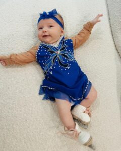 Tara Lipinski Instagram - Georgie’s 1st Halloween! ⛸️❄️ @bradgriffies made a costume that will be hard to match. Thank you!!!! Does anyone recognize it?! @toddkap commentated Gigi’s performance and I of course gave her an old school perfect 6.0 score of course! Brad - again thank you! It’s just too much. You are a talent and skaters are lucky to wear your beautiful designs. #babysfirsthalloween #halloween #newbornhalloween #figureskating #skating #olympics