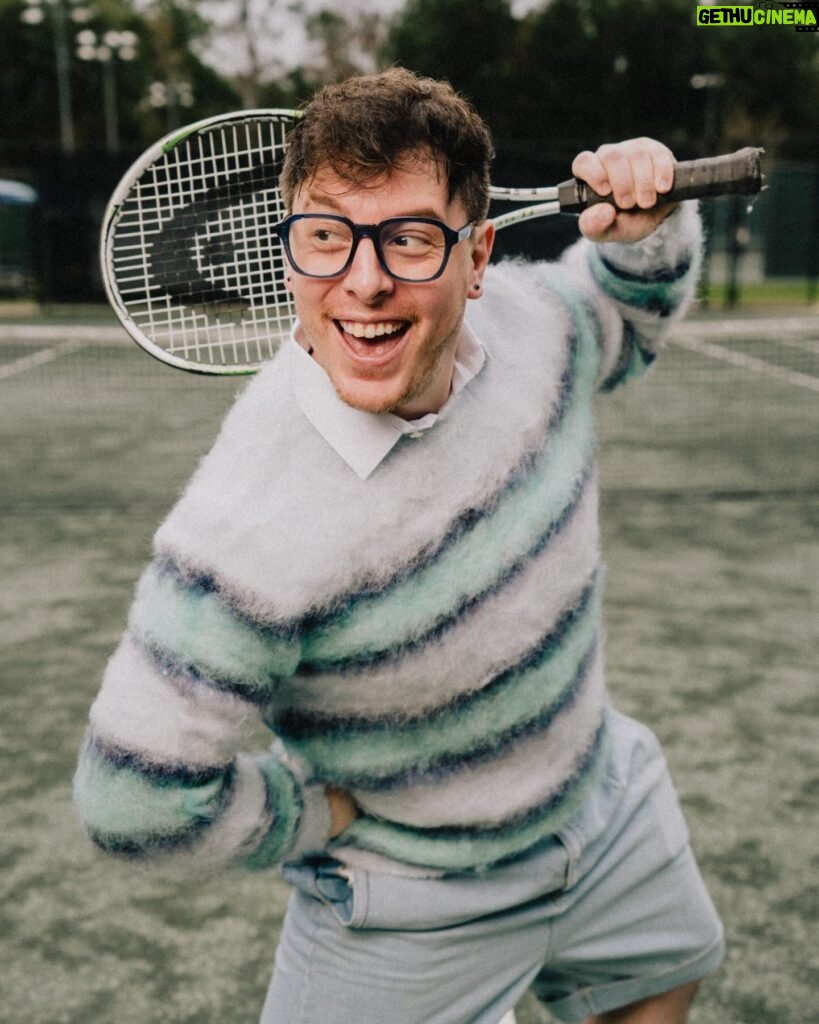 Thomas Sanders Instagram - getting kicked out of the country club 🎾 (📸: @jameslightner; 👕: @dpstyledme) it’s officially been TEN YEARS since Patton first made the scene as Dad Guy in my Vines. Ten years I’ve been with this character. I love him so much. So we created a fun look inspired by him. And I have him playing tennis… cause he would make a TEN-nis joke. Happy “Birthday”, Patton 🩵🎂