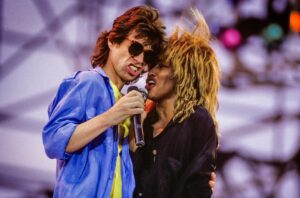 Tina Turner Instagram - I cherish the memory of performing at LiveAid with my friend Mick Jagger this week in 1985. LiveAid was inspired by the work of Claire Bertschinger, a nurse who toiled to save children in Africa -- a touching reminder to appreciate those behind the scenes who create goodness in our world! This great photo is by Lynn Goldsmith, whom I’ve known since the 1970s, and you can find other previously unpublished gems she’s taken in my book “Happiness Becomes You.”
 
Photo copyright: @lynngoldsmith 
#liveaid #lynngoldsmith #happinessbecomesyou