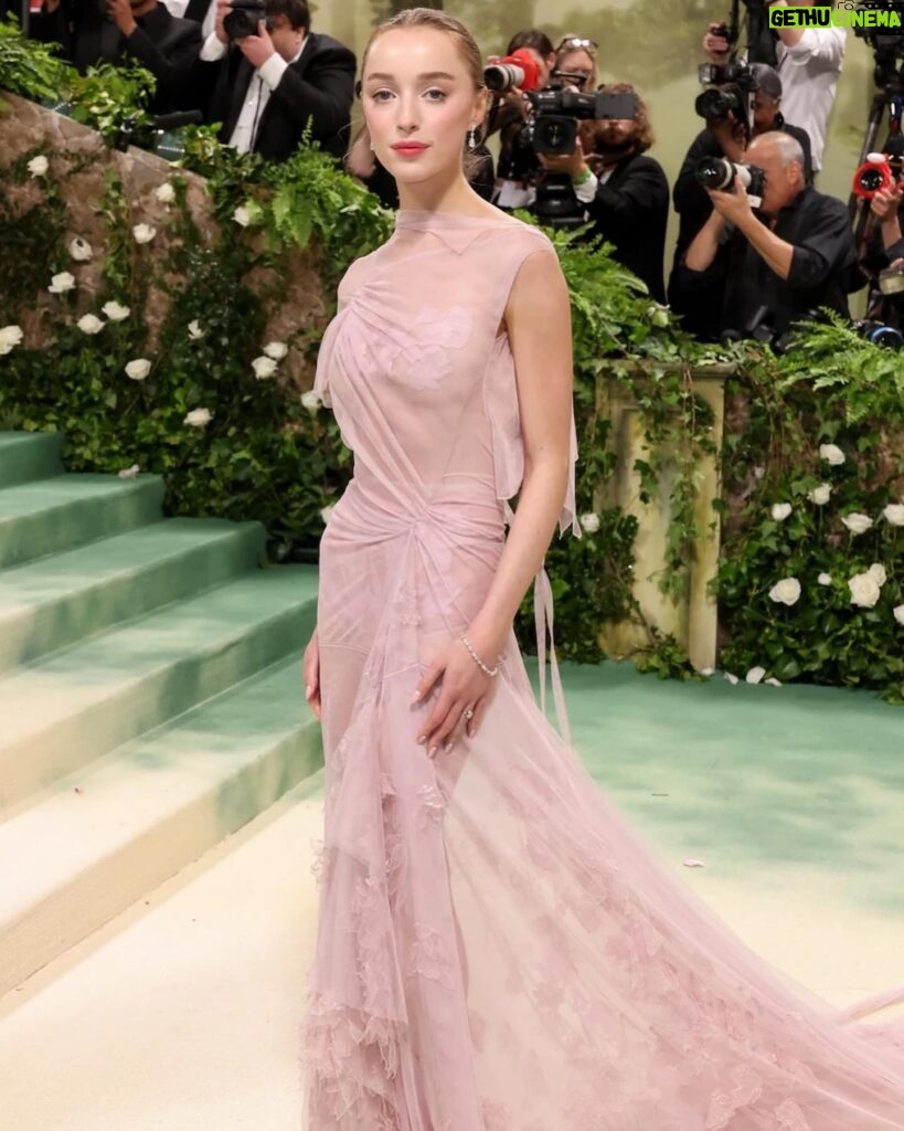 Victoria Beckham Instagram - British star, Phoebe Dynevor wore a custom Victoria Beckham gown to last night’s Met Gala. In a nod to this year’s ‘Sleeping Beauties’ theme, the ethereal silhouette was hand-crafted from archival lace, and embellished with over 300 lace appliqué flowers, hand-cut and hand-sewn onto a tulle base. Find out more in stories… #VBMetGala