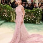 Victoria Beckham Instagram - British star, Phoebe Dynevor wore a custom Victoria Beckham gown to last night’s Met Gala. In a nod to this year’s ‘Sleeping Beauties’ theme, the ethereal silhouette was hand-crafted from archival lace, and embellished with over 300 lace appliqué flowers, hand-cut and hand-sewn onto a tulle base. Find out more in stories… #VBMetGala