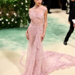 Victoria Beckham Instagram - British star, Phoebe Dynevor wore a custom Victoria Beckham gown to last night’s Met Gala. In a nod to this year’s ‘Sleeping Beauties’ theme, the ethereal silhouette was hand-crafted from archival lace, and embellished with over 300 lace appliqué flowers, hand-cut and hand-sewn onto a tulle base. Find out more in stories… #VBMetGala