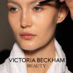 Victoria Beckham Instagram - FRESH OFF THE RUNWAY: NEW! SATIN KAJAL LINER IN LINEN by @victoriabeckhambeauty As seen at my Autumn/Winter 2024 runway show and launching today! I love this soft white shade. It’s the perfect touch of bright to complement sun-drenched summer skin. Once it’s set, it’s summer-proof. #VictoriaBeckhamBeauty
