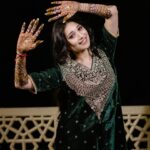 Vrushika Mehta Instagram - Mehendi night was filled with colours and giggles. We had a fun mission too – getting Saurabh to find his name in the mehendi design! 😄💍 Our families danced, laughed, and celebrated together, making it a beautiful night filled with love and joy. 💃❤️ Captured by: @smaryafilms Wearing: @gulabo_jaipur Jewellery: @neo_jewellers #rabhdivrushyy #mehndi