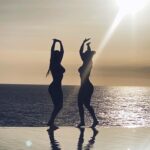 Yolanthe Cabau Instagram - This is a genuine moment of joy captured between my sister Marina and me. There was no posing involved, unlike earlier in the afternoon; we weren't even aware at this point that our other sister had taken this photo. Right before this picture, we had participated in a heart opening cacao ceremony. When we returned to this magical spot, we spontaneously began dancing together as if no one was watching. I wish we had a video of that moment; But this picture means a lot to me. My dear sisters, I love you immensely! Thank you for sharing such pure, loving, fun, and enjoyable moments together. 💫🤍