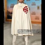 Yvonne Orji Instagram - Lord, have mercy. Father, help us all… 🙏🏾 • Yall, The @bookofclarence is a MUST SEEE! The performances were brilliant. The direction is immaculate. @jeymes did what was SUPPOSED to be done! In theaters THIS Friday! Let’s break the box office • Hair: @jacobaaronn Makeup: @kimoramulan Cape: Vintage boutique in Florence, Italy Shorts: @altuzarra Boots: @schutz Earrings: @earring_envy Glow: The Glory of God.