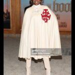 Yvonne Orji Instagram - Lord, have mercy. Father, help us all… 🙏🏾 • Yall, The @bookofclarence is a MUST SEEE! The performances were brilliant. The direction is immaculate. @jeymes did what was SUPPOSED to be done! In theaters THIS Friday! Let’s break the box office • Hair: @jacobaaronn Makeup: @kimoramulan Cape: Vintage boutique in Florence, Italy Shorts: @altuzarra Boots: @schutz Earrings: @earring_envy Glow: The Glory of God.