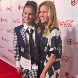 Abby Ryder Fortson Instagram - MY MOM!!! I couldn’t have done any of this at @cinemacon without my mom right by my side!!!! @christielynnsmith ❤️❤️❤️
.
 @lionsgate @margaretmovie 
.
.
Shout outs!!!
Stylist @taraswennen 
Glam @natasharg 
Incredible suit  @thombrowne ❤️
Boots @docmartensshoes 
Photographer @kevinfrazier first picture of me and my mom and the best host ever!! @entertainmenttonight @bentrivett cute Polaroid!
Pants @rouje 
Shirt @mantu_castor 
Shoes @andotherstories 
Jewelry @castjewelry 
Jacket @dolcegabbana 
.
@christielynnsmith 
Dress @eileenfisherny 
Jewelry @hannahkjewelry 
Shoes @aglshoes
Jumpsuit @madewell 
Blazer @dkny