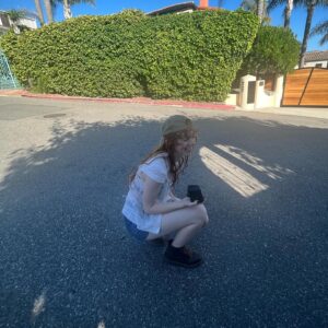 Abby Donnelly Instagram - my hobbies include:
 •dusting sand off sunscreen 
 •pretend hitchhiking 
 •standing in the road to take a picture