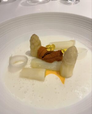 Aiste Miseviciute Instagram - One of my favorite dining experiences recently was at the one Michelin starred Saddle @saddlemadrid in Madrid, which now occupies the former location of the renowned Jockey restaurant. Jockey, a historical landmark in Spain's gastronomic, political, and cultural scene, operated from 1945 to 2012 under Clolado Cortés, who revolutionized hospitality by prioritizing the diner's experience. In October 2019, Saddle opened as a tribute to Jockey's legacy, focusing on French haute cuisine that highlights seasonal ingredients at their prime. Led by chef Pablo Laya, Saddle is dedicated to honoring culinary traditions, especially by showcasing produce when it's in season.

- Amazing, slowly roasted veal shank, tribute to the legendary chef Santi Santamaría, with potato purée and beef jus
- Butter service
- A very generous portion of Maresme teardrop green peas (gold standard of peas) and Tokaji Oremus wine sabayon
- White asparagus from Navarra, sea urchin, smoked egg yolk and vegetables soup
- The excellent wine pairing by @patrickfonsek 
- Souffé Grand Marnier
- The very impressive spirits trolley